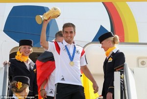 To me this looks like Lahm tried to fist pump with the trophy 